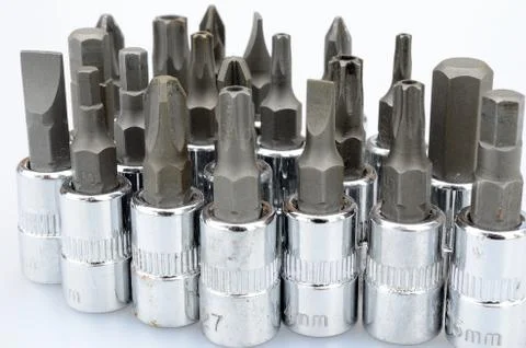 Different types of bits for socket wrenches isolated on white background macr Stock Photos