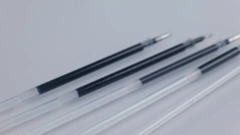 Different types of black gel pen refills arranged together. Stock Footage 345461070