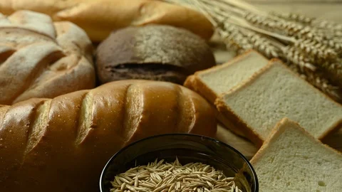 Different types of bread lies on the table Stock Footage 126765014