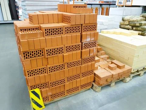 Different types of bricks in warehouse store. Construction Materials 스톡 사진