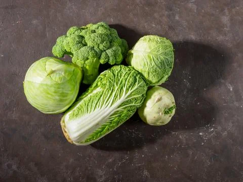 Different types of cabbage on black background. Foto stock