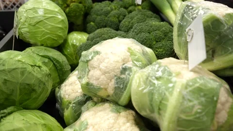 Different types of cabbage on the counter of the store. Green cabbage Stock Footage 232220080