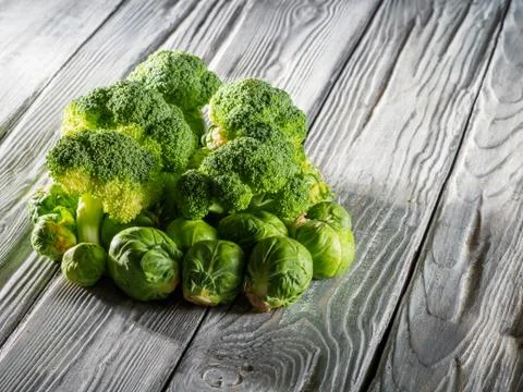 Different types of cabbage on wooden background. Stock Photos