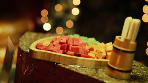 Different types of cheese. Cheese slices lie in rows on the counter during the Stock Footage 224536751