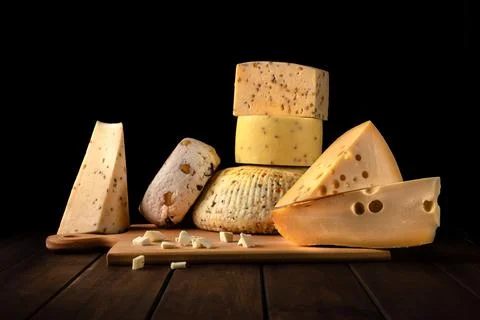 Different types of cheese on a cutting board 写真素材