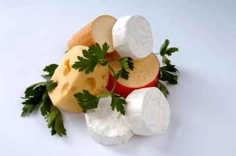 Different types of cheese on a gray background Stock Photos