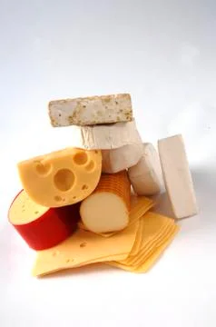 Different types of cheese on a gray background Stock Photos
