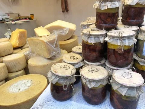 Different types of cheese on the table. Many cheese is sold at an agricultura Stock Photos