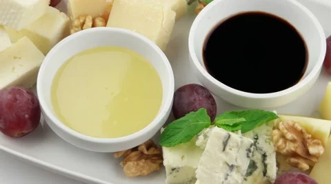 Different types of cheese on a white long plate 動画素材 58001693