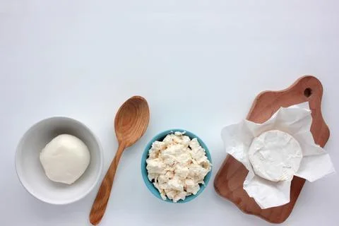 Different types of cheese on white table. Stock Photos