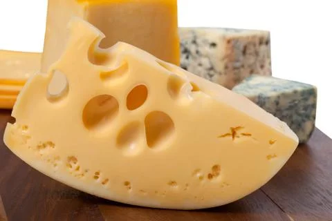 Different types of cheese on wooden table Stock Photos