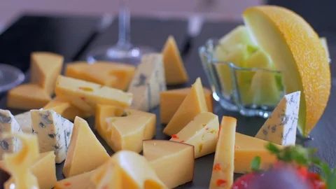 Different types of cheeses on black stone look very appetizing 動画素材 109126890