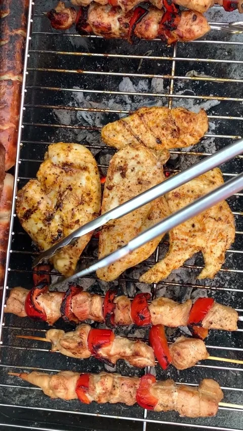 Different types of chicken meat, steak and sausage are fried on barbecue, j.. Video stock 318786953
