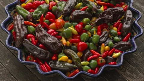Different types of chilies on a platter. Video stock 342348404