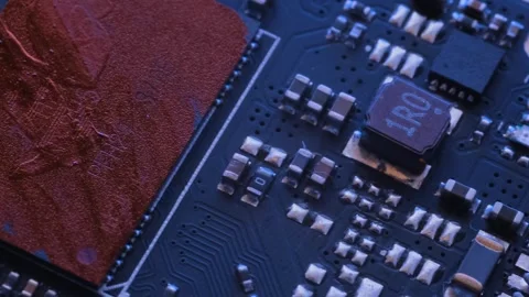 Different types circuits and chip lie on table tracking macro close up. Stock Footage 246952022