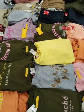 Different types of clothes on a white background Stock Photos