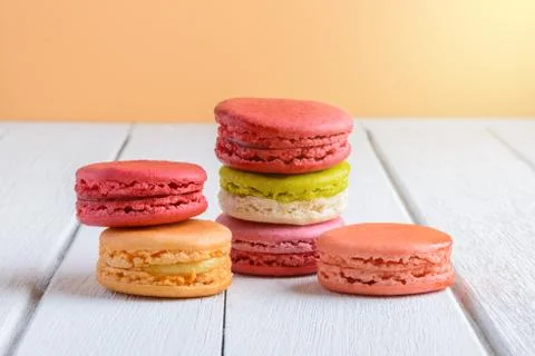 Different types color of macaroons on white wooden background Stock Photos