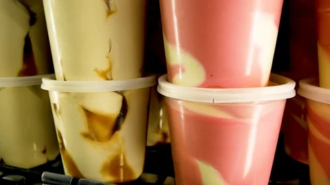 Different types of colourfull ice cream in the fridge close-up Stock Footage 114079023