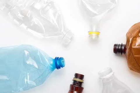 Different types of crushed plastic bottles on white background. Copyspace for Stock Photos