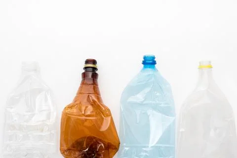 Different types of crushed plastic bottles on white background. Copyspace for 写真素材