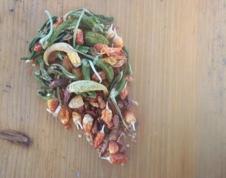 Different types of dried chilli on a wooden background Stock Photos