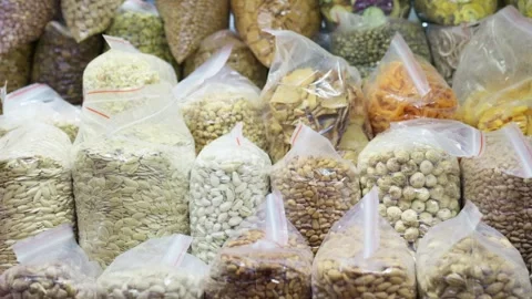Different types of dry goods packed in transparent plastic bags Stock Footage 322776727