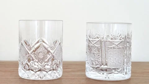 Different types of elegant empty crystal glasses on the table Stock Footage 287916354