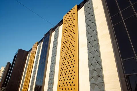 Different types of facade tiles. View looking up yellow white gray black ge.. Stock Photos