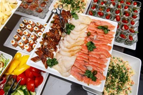 Different types of fish on the banquet table. Stock Photos