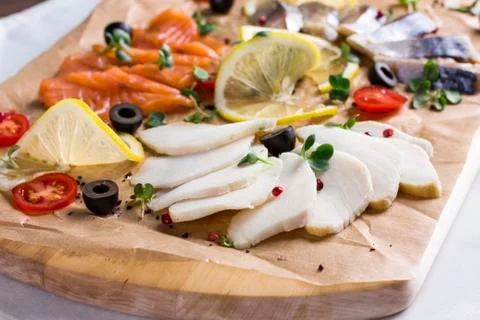 Different types of fish herring, salmon on wooden Board Stock Photos