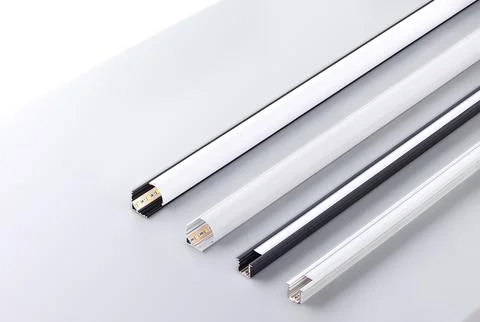 Different types of frame profiles are placed on a light surface for display.. 写真素材