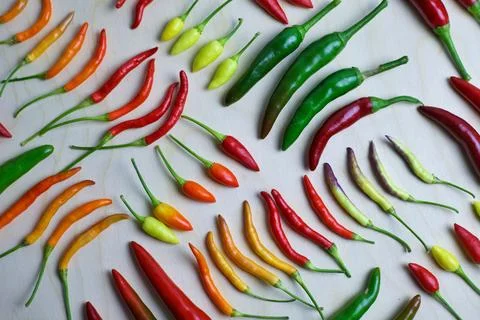 Different types of hot pepper in different colors from green to purple Stock Photos