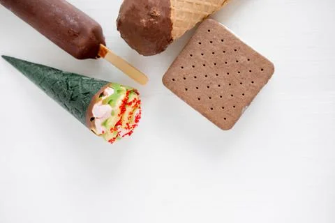 Different types of ice cream on a light wooden background with a place for an Stock Photos