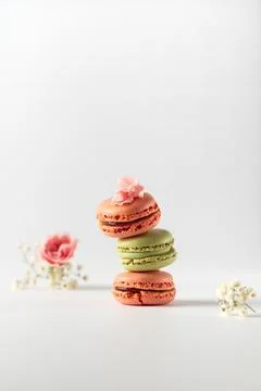 Different types of macaroons on a white background. Pink and green macaroons. Stock Photos