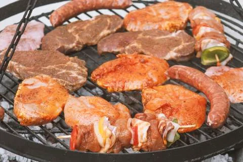 Different types of meat are grilled Stock Photos