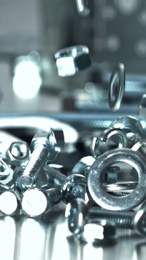 Different types of mechanical fasteners arranged uniquely Filmed on a high-speed Stock Footage 335395866