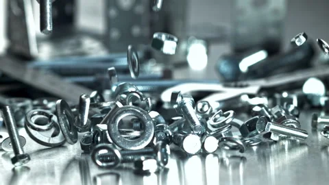 Different types of mechanical fasteners arranged uniquely Filmed on a high-speed Stock Footage 335412657