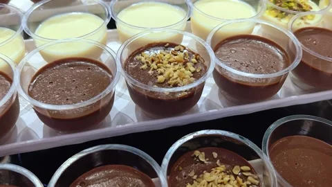 Different types of mousse in transparent cups. Catering set. Stock Footage 314517435