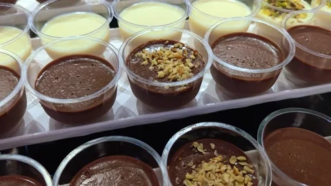 Different types of mousse in transparent cups. Catering set. Stock Footage 317845139