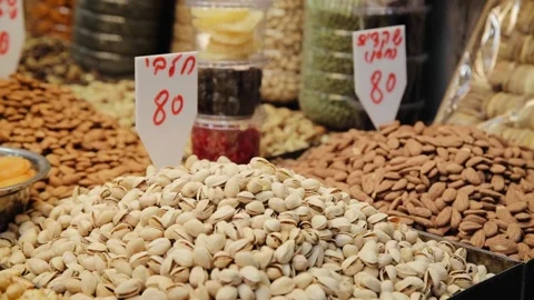 Different types of nuts and pistachios is on the sale in market of Tel Aviv Stock Footage 181648989