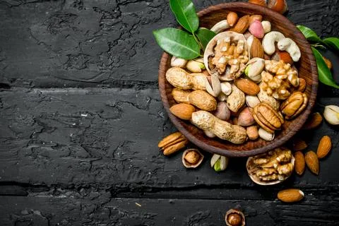 Different types of nuts in bowl. Stock Photos