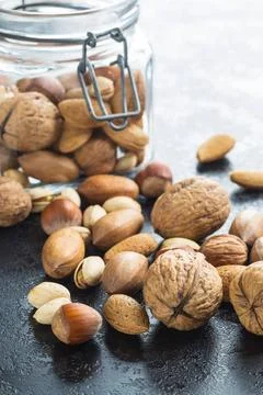 Different types of nuts in the nutshell. Different types of nuts in the nu... Stock Photos