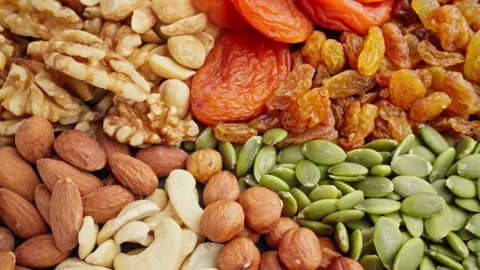 Different types of nuts rotate. Vegetarian meal. Healthy eating concept. Stock-Footage 297607450