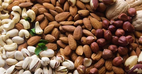 Different types of nuts, seeds and dried fruits	 Stock Footage 131955378