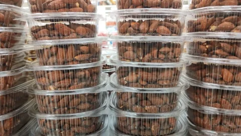 Different types of nuts in transparent plastic boxes Video stock 287887721