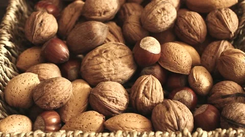 Different types of nuts: walnut hazelnut cashew peanuts brazil nuts pine Vídeos de archivo 64745602