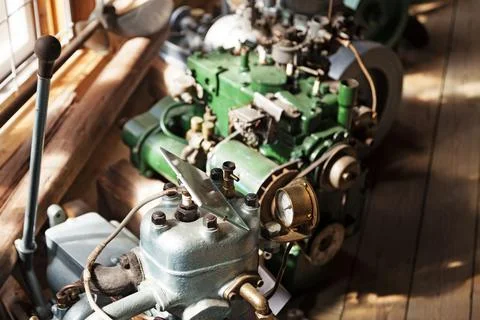 Different types of old engines in a row by the window Fotos de archivo
