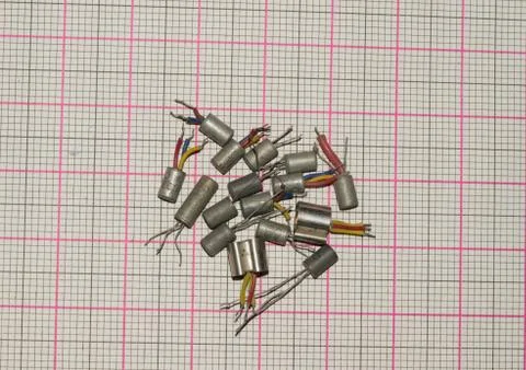 Different types of old germanium transistors isolated on a graph paper backgr Stock Photos