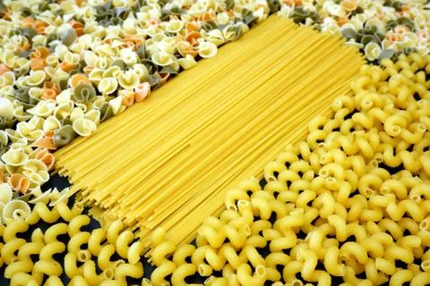Different types of pasta close up background. Spaghetti and cavatappi. 스톡 사진