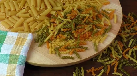 Different types of pasta on cutting board Stock Footage 58944998